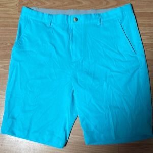 Light blue Greg Norman Microlux golf shorts. Size 34